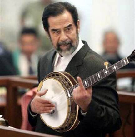 saddam-playing-banjo.jpg