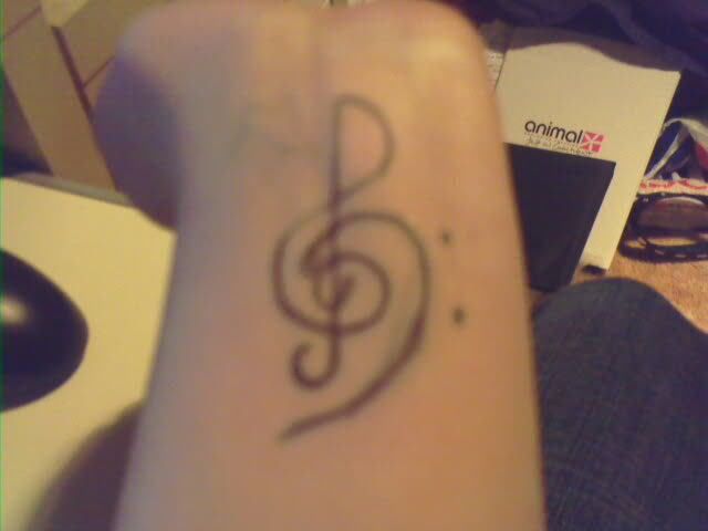 I might just get a bass clef done on my left wrist, but kinda done in a 