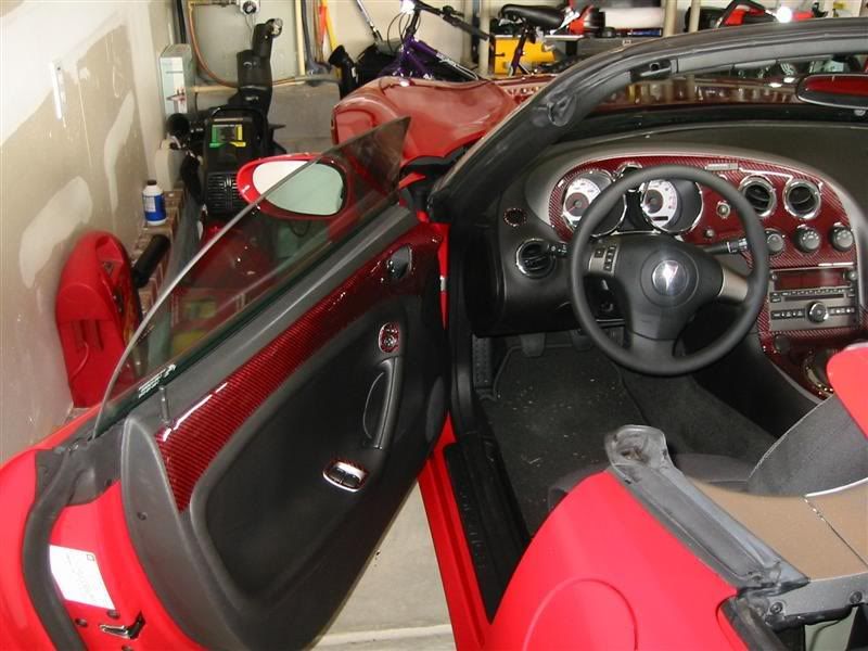 Red and black Carbon Fiber dash kit installed on aggressive sol
