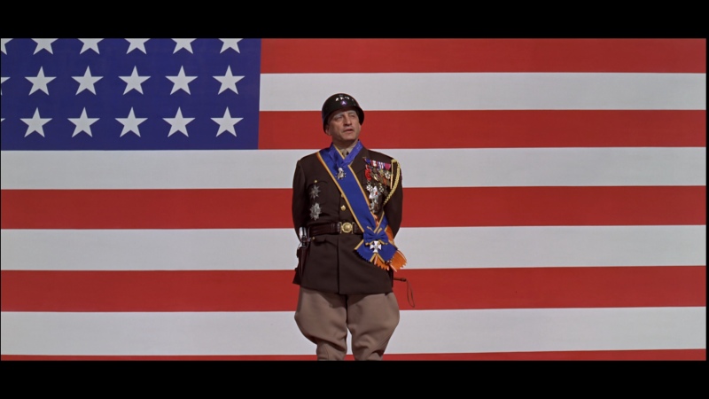  photo patton_speech_in_front_of_giant_flag_george_c_scott_zpsepdvitkf.png