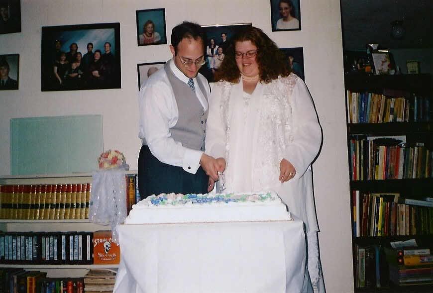 Michelle and I cutting the cake together.