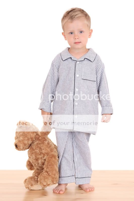 boy in pajamas with teddy bear