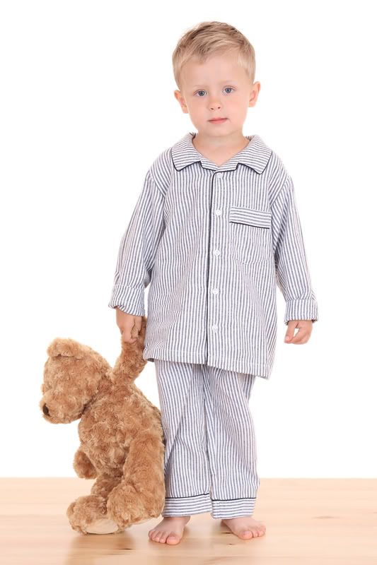 boy in pajamas with teddy bear